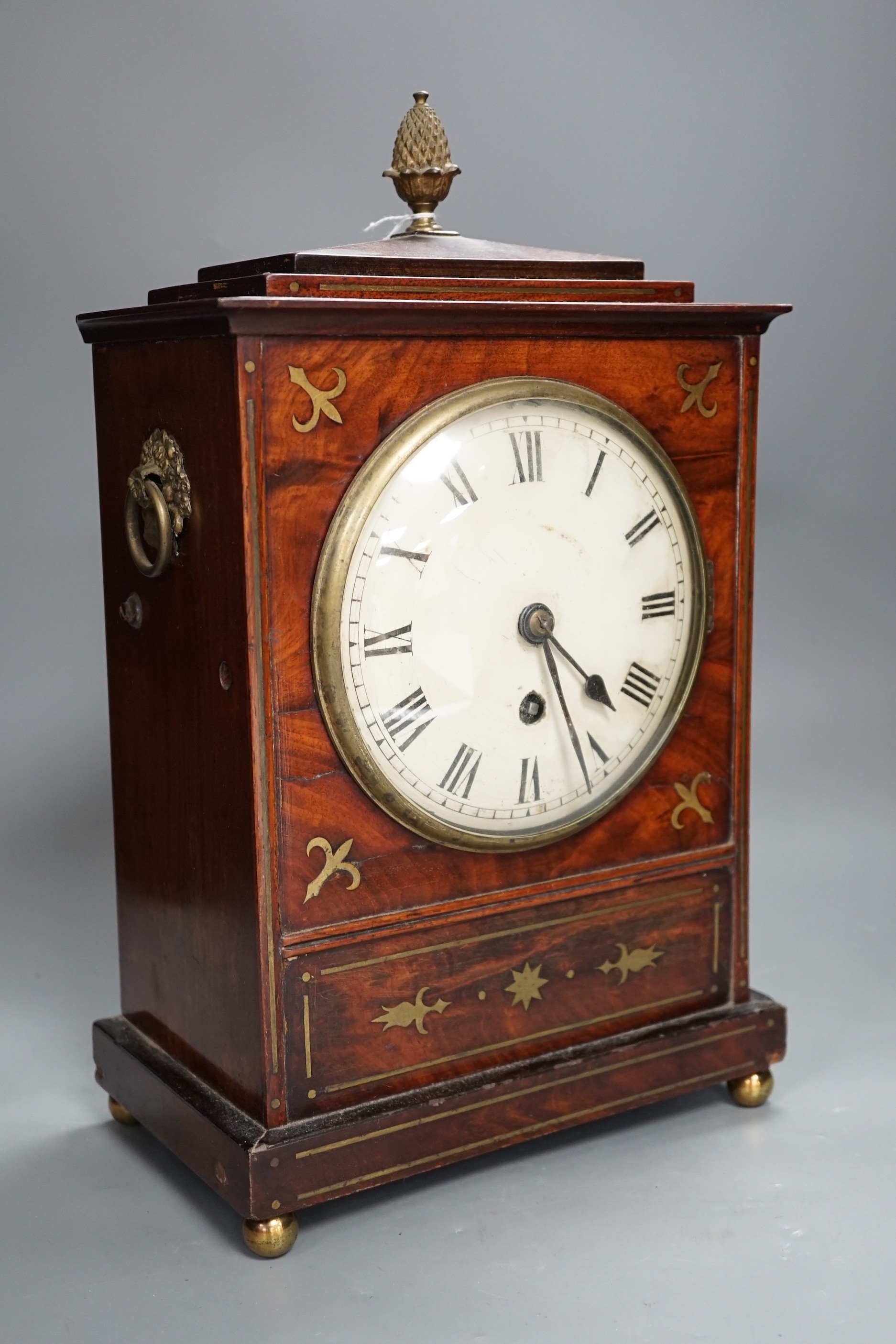 A Regency brass inset mahogany mantel timepiece, 39cm high